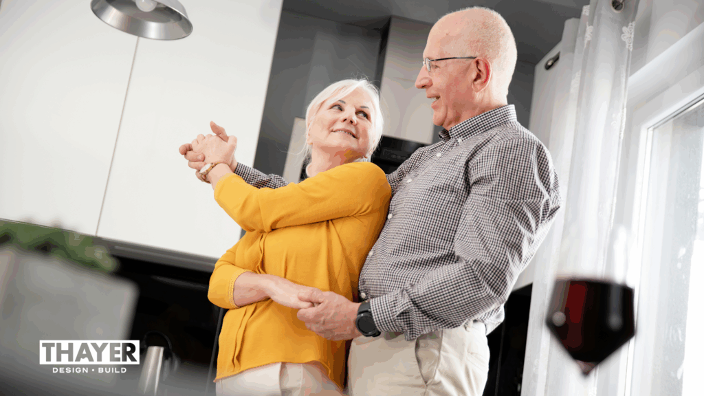 Older couple dancing in their kitchen