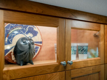 Clear glass kitchen cabinets in Corvallis home remodel