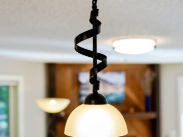 Close up of peninsula pendent light in Corvallis home remodel
