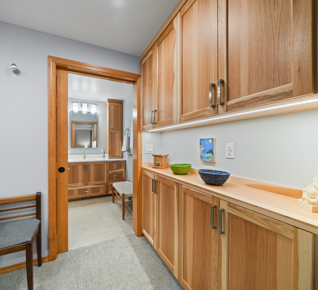 Primary suite closet and bathroom in aging-in-place remodel