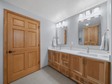 Hall bathroom vanity Primary bathroom shower in aging-in-place remodel