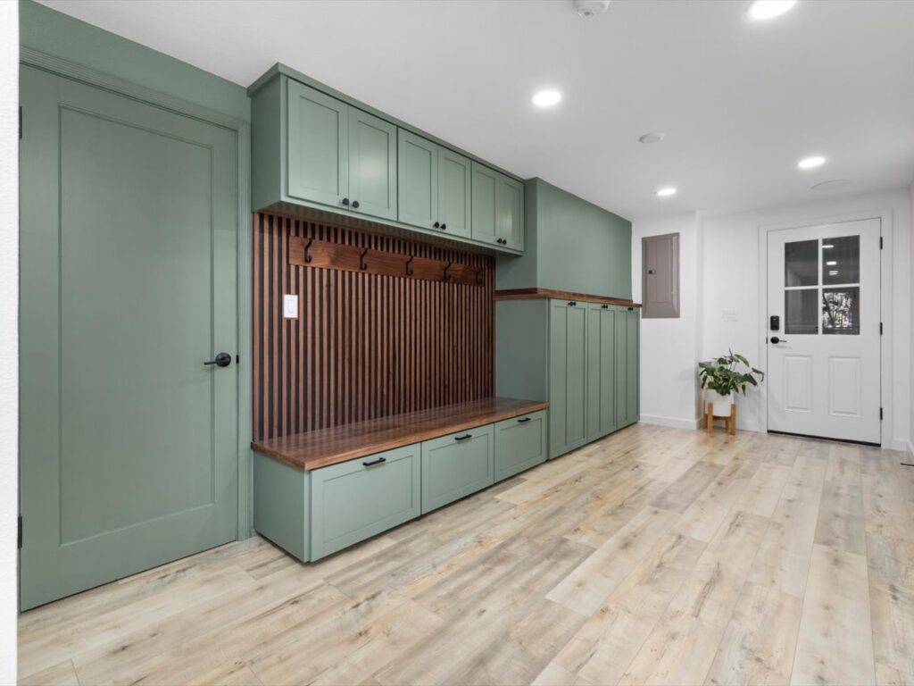 Basement remodel in Corvallis featuring a mudroom area and built in cabinetry and seating